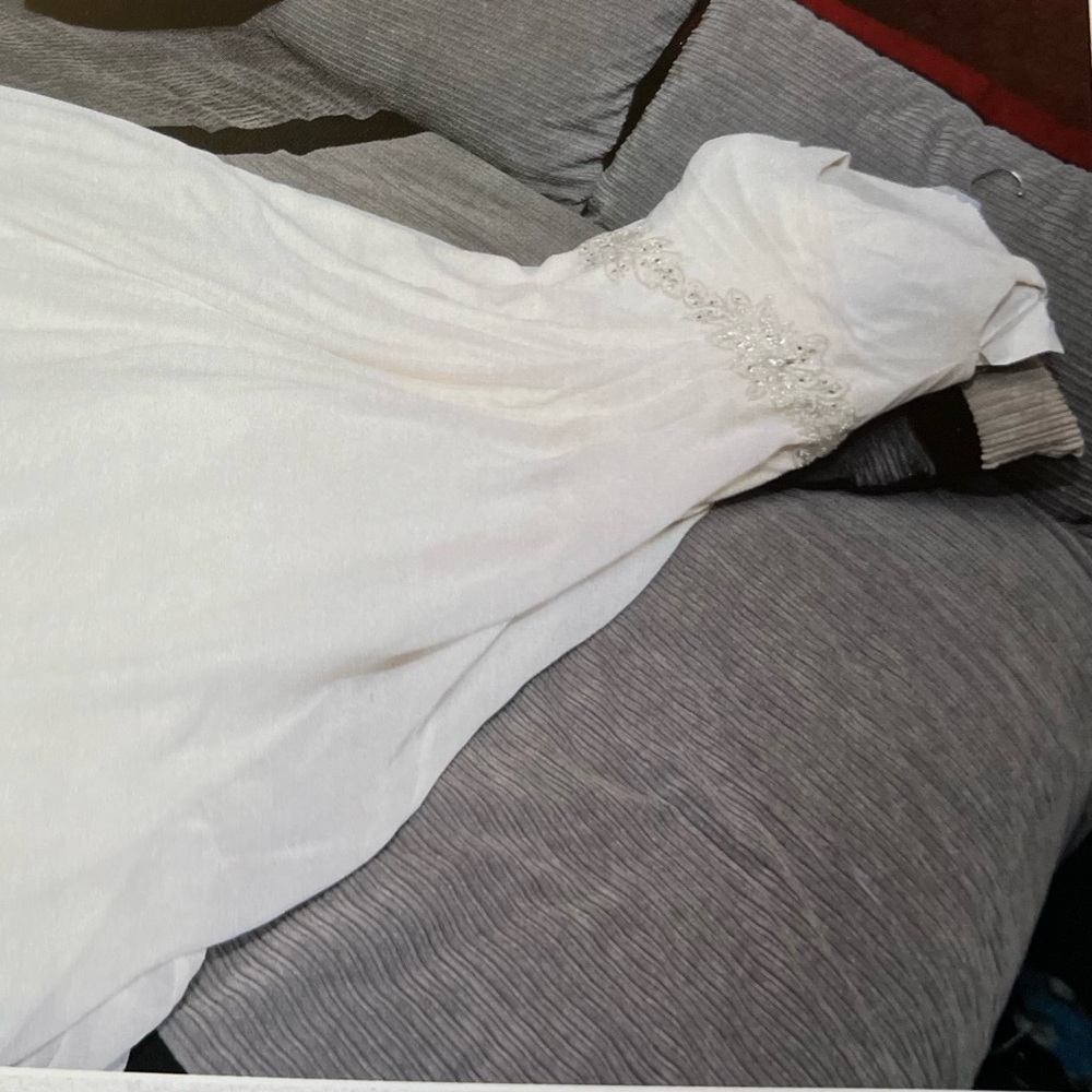 Size 14 off white A-Line cut Wedding Dress. Worn once in 2014 then preserved.